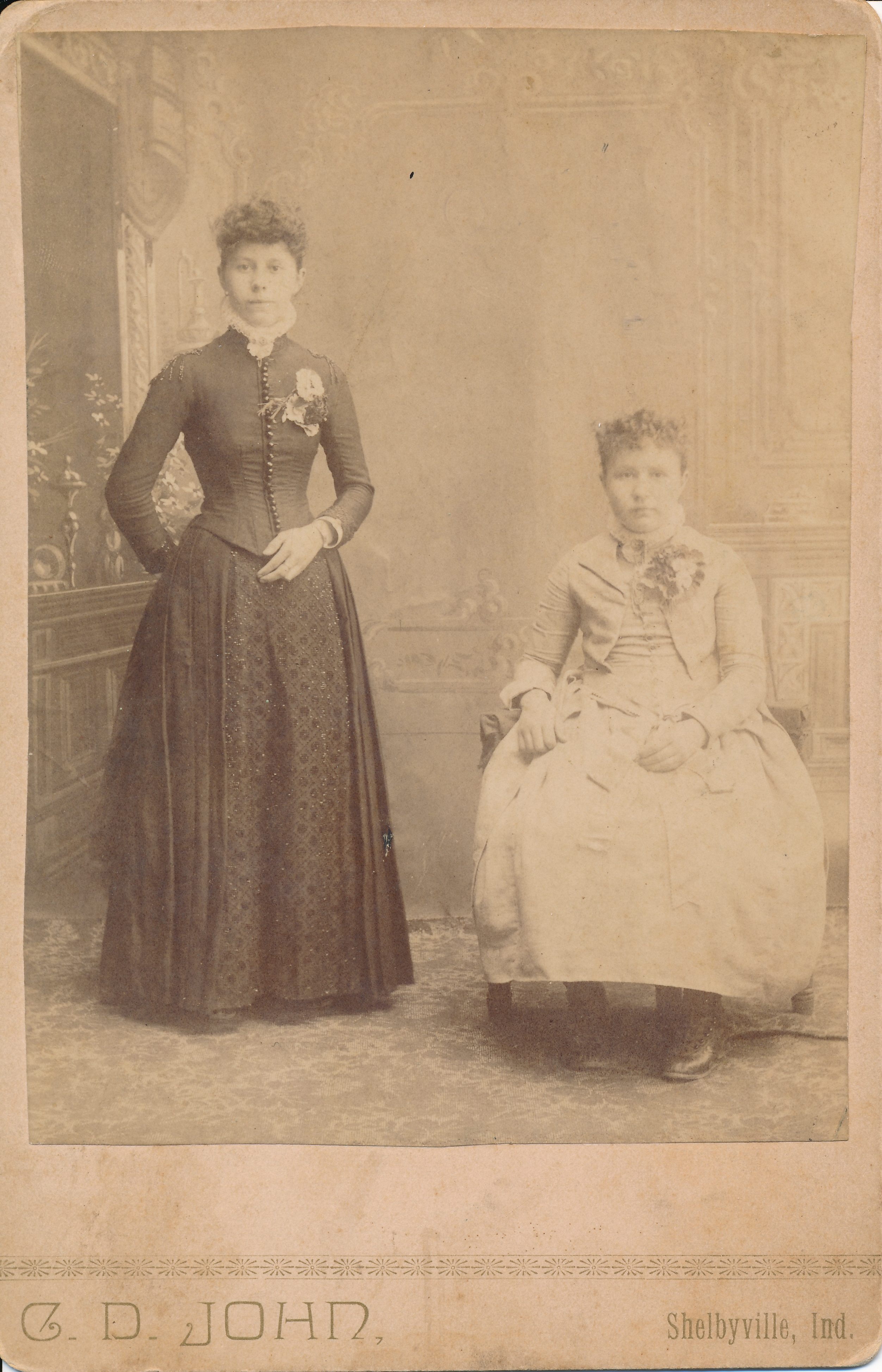 Two of George and Julia's daughters — Della (standing) and Daisy